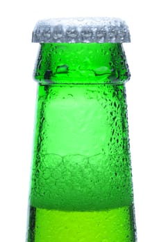 Macro shot of a green beer bottle neck and cap with condensation. Vertical format over a white background.