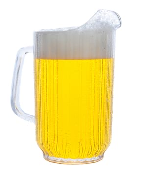 Pitcher of beer in vertical format over white.