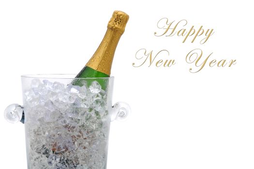 A champagne bottle in a cyrstal ice bucket with the words Happy New Year with room for additional copy.