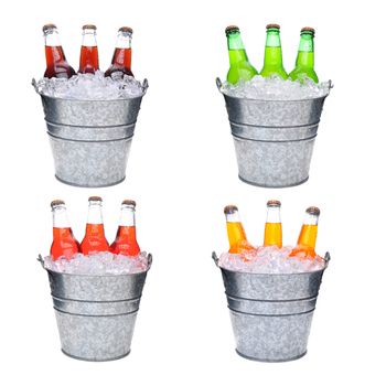 Four ice Buckets Filled with three soda bottles, each pail has a different flavored soft drink, Lemon-Lime, Cola, Orange and Strawberry.