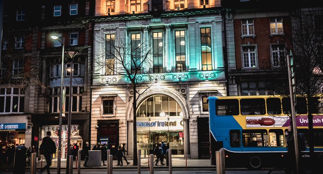 Dublin, Ireland - February 12, 2019: Night street atmosphere in the streets of the historic center where people walk on a winter day