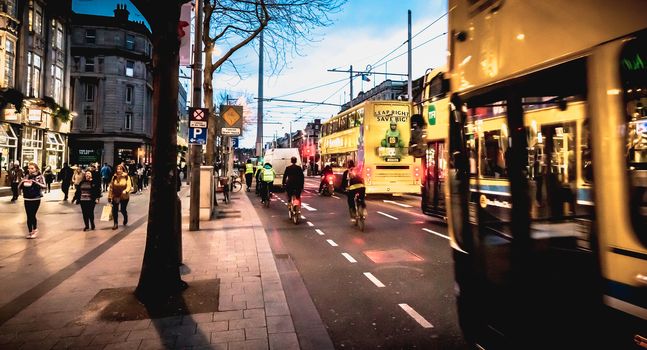 Dublin, Ireland - February 12, 2019: Night street atmosphere in the streets of the historic center where people walk on a winter day