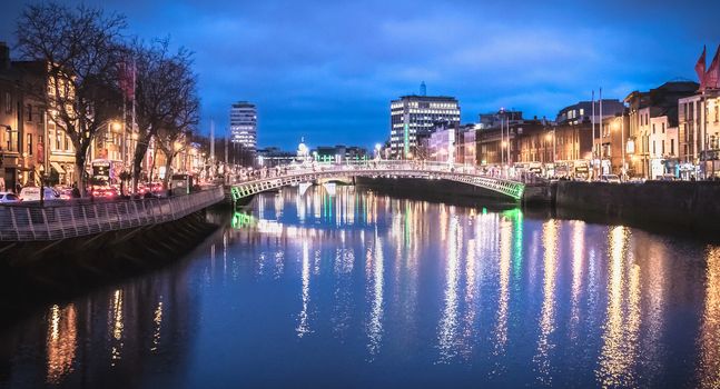 Dublin, Ireland - February 12, 2019: Night street atmosphere in the streets of the historic center where people walk on a winter day