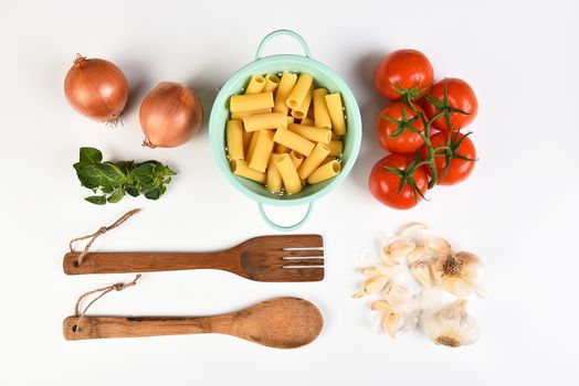 Top view of the ingredients for an Italian meal on white.