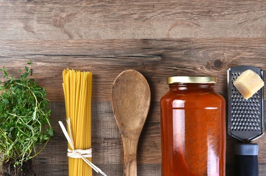 The components for making a traditional Italian Spaghetti dinner. Top view with copy space.