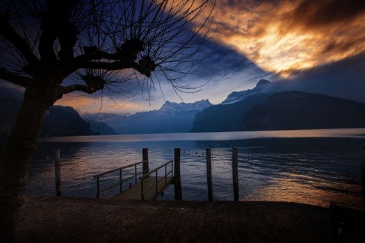 dramatic reflection in the sky and clouds during sunset at lake Lucerne in Switzerland