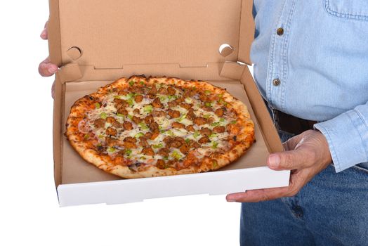 Deliveryman holding a open pizza box with a sausage pizza. Man is unrecognizable isolated over white.