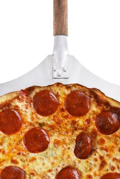 Closeup of a Pepperoni Three Cheese Pizza on a Peel isolated on white.