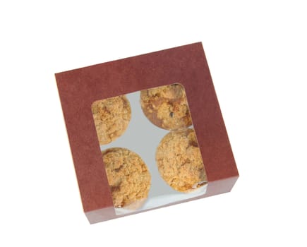 An overhead shot of a bakery box with four muffins, over a white background.