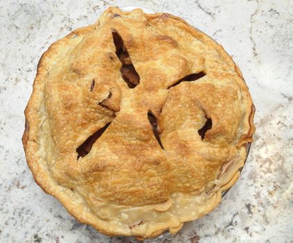 Freshly Baked Apple Pie Cooling on Granite Countertop - Square Format seen from high angle