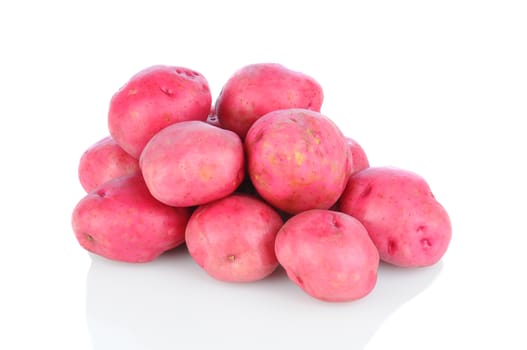 A pile of red potatoes on a white background with reflection, Horizontal format.