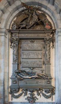 Brussels, Belgium - September 26, 2018: Evrad T’Serclaes, slain mayor, bronze statue and fresco adjacent to town hall off Grand Place, Grote markt, offers love powers to those who caress him.