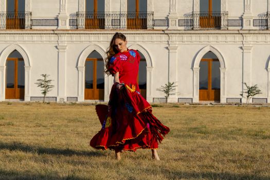 A gorgeous Hispanic Brunette model poses outdoors in home environment