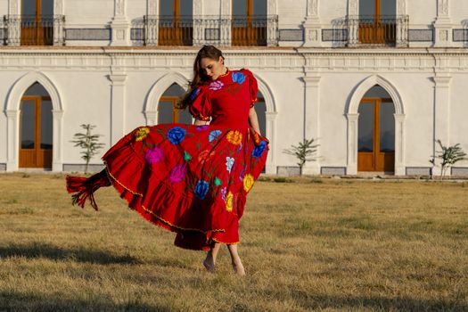 A gorgeous Hispanic Brunette model poses outdoors in home environment