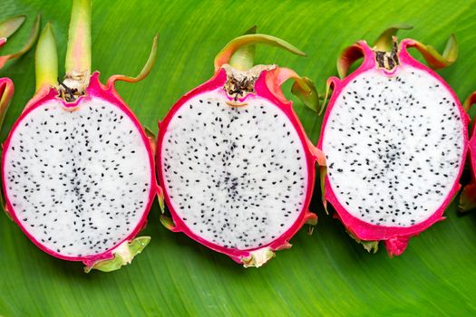 Dragonfruit or pitahaya on banana leaf background.