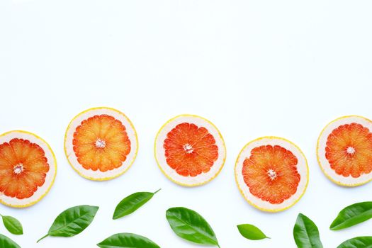 High vitamin C. Juicy grapefruit slices on white background.