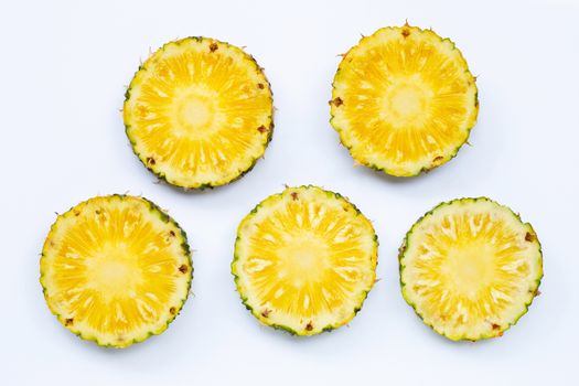 Fresh pineapple slices on white background. Top view