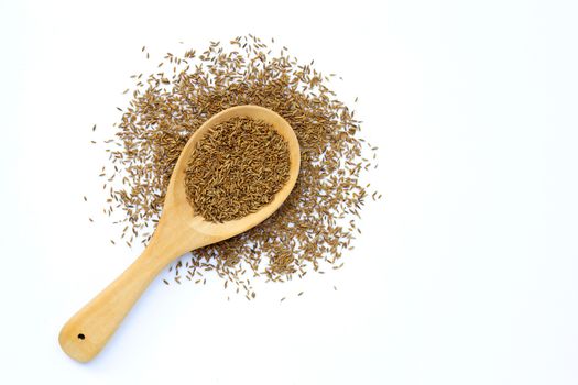 Cumin or caraway seeds on white background. Top view