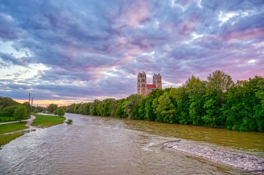 The Church of St. Maximilian along the Isar River at sunset in Munich, Bavaria, Germany.