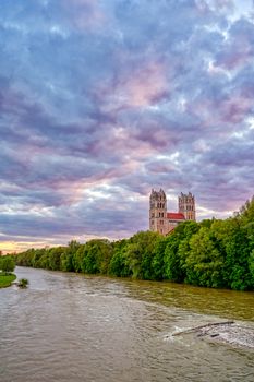 The Church of St. Maximilian along the Isar River at sunset in Munich, Bavaria, Germany.