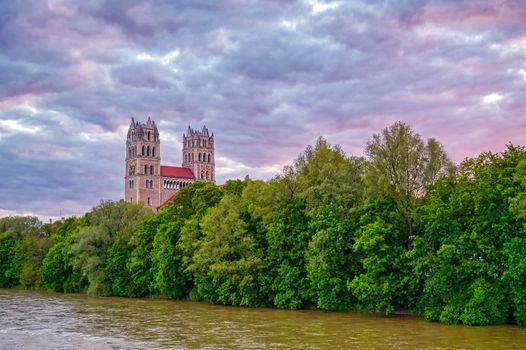 The Church of St. Maximilian along the Isar River at sunset in Munich, Bavaria, Germany.