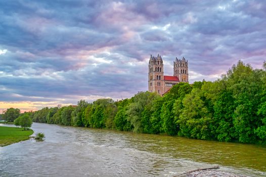 The Church of St. Maximilian along the Isar River at sunset in Munich, Bavaria, Germany.