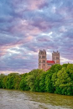 The Church of St. Maximilian along the Isar River at sunset in Munich, Bavaria, Germany.