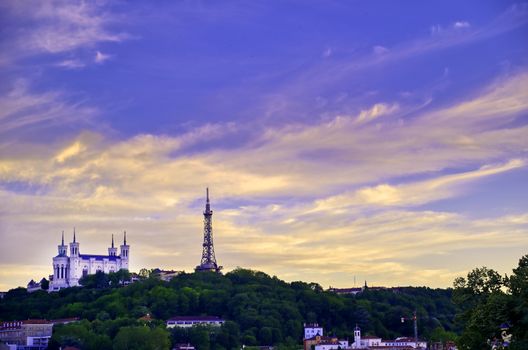 Lyon, France and the Basilica of Notre-Dame de Fourvière at sunset.