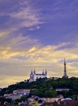 Lyon, France and the Basilica of Notre-Dame de Fourvière at sunset.