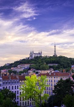 Lyon, France and the Basilica of Notre-Dame de Fourvière at sunset.