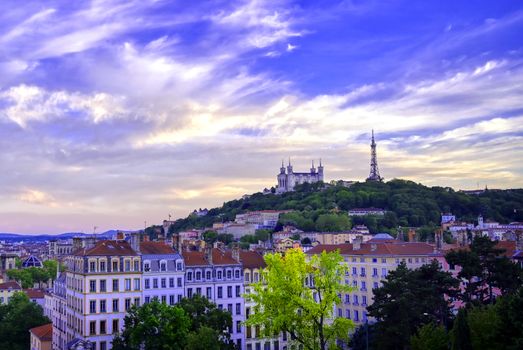 Lyon, France and the Basilica of Notre-Dame de Fourvière at sunset.