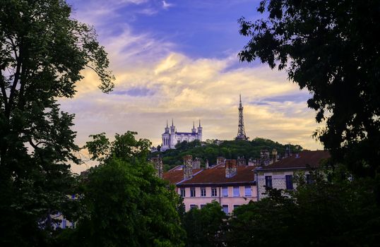 Lyon, France and the Basilica of Notre-Dame de Fourvière at sunset.