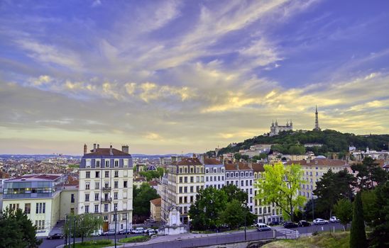 Lyon, France and the Basilica of Notre-Dame de Fourvière at sunset.