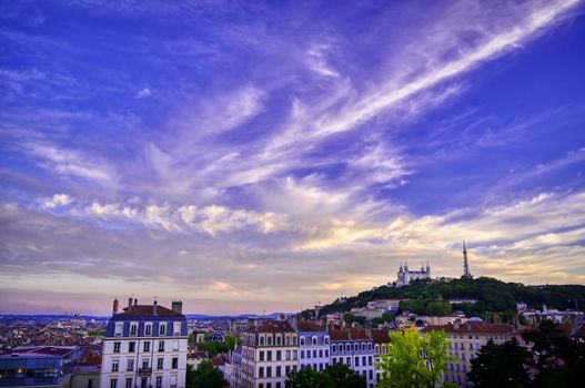 Lyon, France and the Basilica of Notre-Dame de Fourvière at sunset.