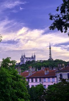 Lyon, France and the Basilica of Notre-Dame de Fourvière at sunset.