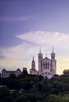 Lyon, France and the Basilica of Notre-Dame de Fourvière at sunset.