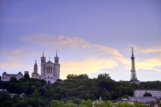 Lyon, France and the Basilica of Notre-Dame de Fourvière at sunset.