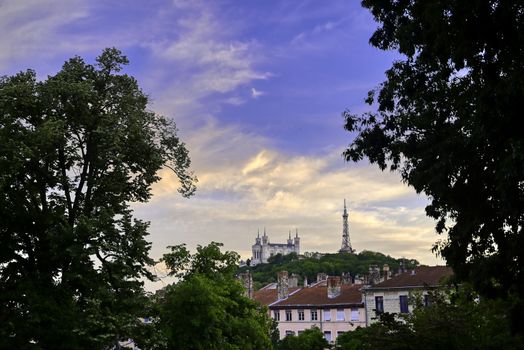 Lyon, France and the Basilica of Notre-Dame de Fourvière at sunset.