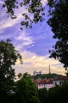 Lyon, France and the Basilica of Notre-Dame de Fourvière at sunset.