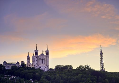 Lyon, France and the Basilica of Notre-Dame de Fourvière at sunset.