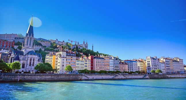 A view of Lyon, France along the Saone river in the afternoon.