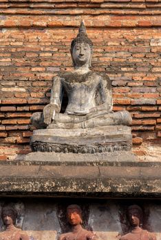 Ancient Buddha Statue at Wat Mahathat in Sukhothai historical park in Sukhothai, Thailand.