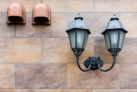 wall lantern installed on the tiles wall.