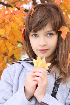 Outdoors autumn time portrait of a girl