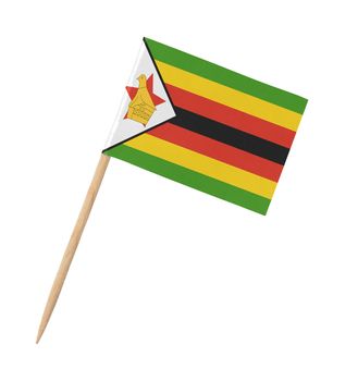 Small paper flag of Zimbabwe on wooden stick, isolated on white