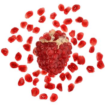 Pomegranate with scattered grain top view on white background.