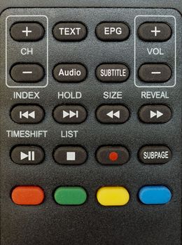 detail of digital terrestrial tv remote control with channel, volume and recording keys