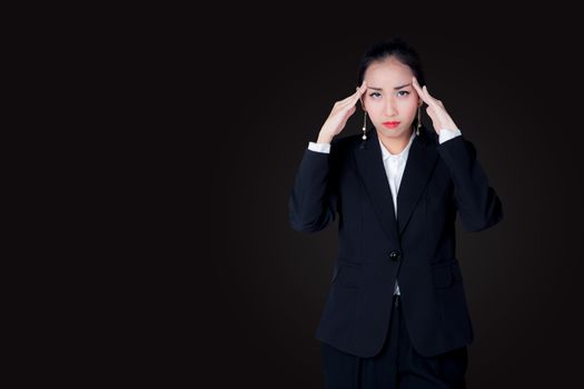 A young business woman have stress overworking with suffering from headache