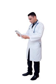 Doctor holding a tablet computer while using it isolated on white background