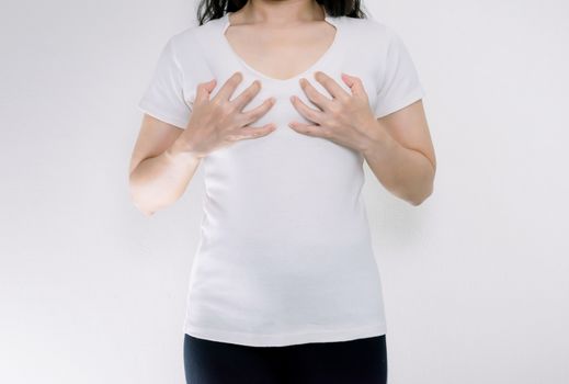 Young woman wearing tshirt holding hands on breast small
